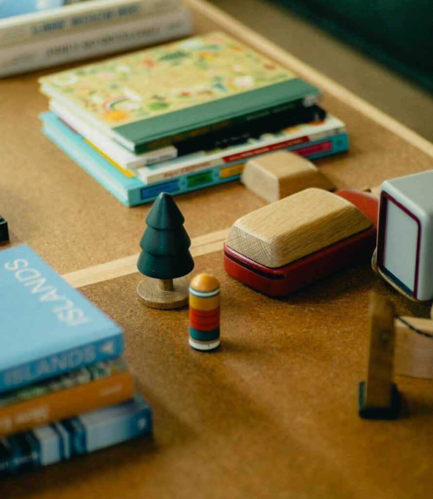 Wooden toys, a toy truck and picture books on our living room table